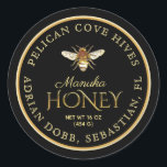 Manuka Honey Black Metallic Gold Vintage Bee Classic Round Sticker<br><div class="desc">"Honey" in a chiseled metallic gold font. Updated vintage honeybee illustration on a black background. Larger text size for apiary name and location,  in brighter pale gold colour. Common honey net weight conversions: 8oz (227g),  12oz (340g),  16oz (454g),  32oz (907g),  5lb (2.27kg).</div>