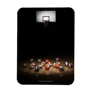 Many basketballs resting on the floor magnet
