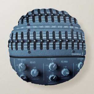 Many buttons on a sound mixer in a recording studi round cushion