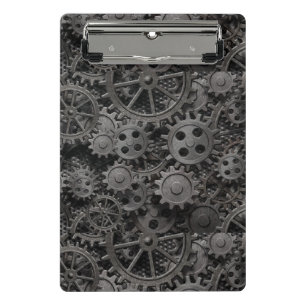 Many old rusty metal gears or machine parts mini clipboard