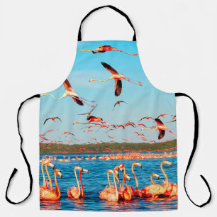 Many pink beautiful flamingos in a beautiful blue apron