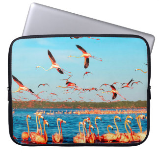Many pink beautiful flamingos in a beautiful blue  laptop sleeve