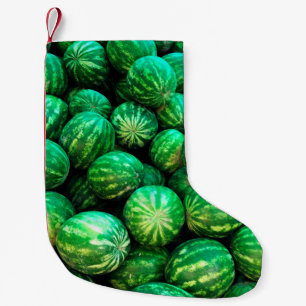 Many watermelons on the market background small christmas stocking