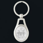Marble Personalised Groomsmen's name and monogram Key Ring<br><div class="desc">Add a personal touch to your wedding with personalised groomsmen keychain. This keychain features personalised groomsman's name with title and wedding date in grey and monogram in light grey as background, in classic serif font style, on white marble background. Also perfect for best man, father of the bride, ring bearer...</div>