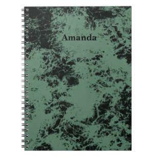 Marble texture pattern in black and green notebook