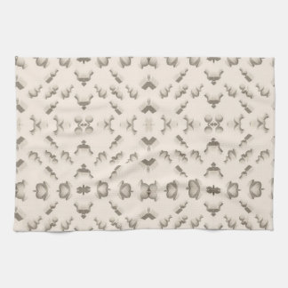 Marble textured geometric sculptures on a beige tea towel
