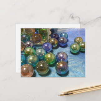 Marbles spilling from a jewelry box postcard