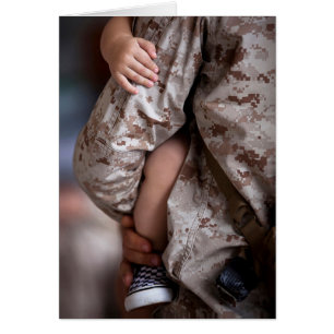 Marine Holding a Child