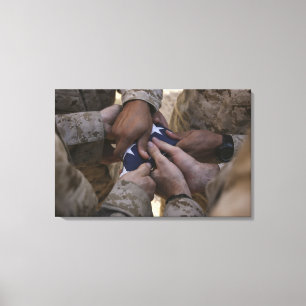 Marines fold an American flag Canvas Print