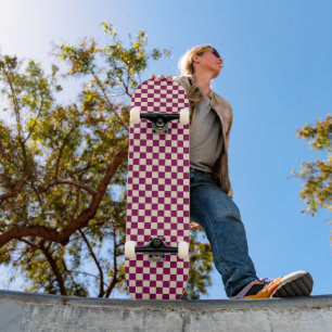 Maroon and beige checkerboard pattern skateboard