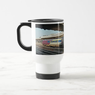 Maroon and beige train , under the bridge travel mug