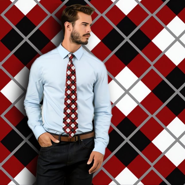 Maroon, Black, White and Grey Argyle Print Necktie (Handsome man wearing maroon argyle necktie. Standing against maroon argyle patterned wall.)