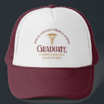 Maroon Gold Medical School Graduate Customisable Trucker Hat<br><div class="desc">This maroon and gold custom medical school graduation hat gift features modern typography for a class of 2024 graduate. Customise with your graduating year under the caduceus for great personalised nurse or doctor keepsake for a graduating physician.</div>