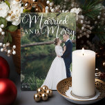 Married and Merry Elegant Wedding Photo Christmas Holiday Card<br><div class="desc">Gorgeous white calligraphy reading Married and Merry over your full wedding photograph for a beautiful newlywed holiday card. This just married couple Christmas card features big cursive script at the top. Add a 2nd couple photo on the back and your personalised text.</div>