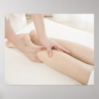 Massage therapist applying foot massage poster