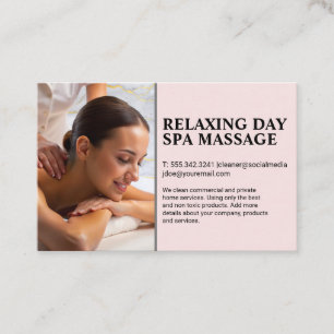 Masseuse giving back massage to woman on spa table business card