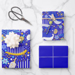 Maximal Hanukkah Wrapping Paper Sheet<br><div class="desc">Colourful dreidels,  menorahs,  and stars on a rich blue background. One sheet each of large and small print,  and one sheet of solid blue.</div>