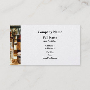 Medicine Bottles in Glass Case Business Card