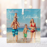 Mele Kalikimaka Family Photo Beach Christmas 2022 Glass Tree Decoration<br><div class="desc">This pretty beach Christmas ornament features your own summer vacation photo from the coast with an elegant typography overlay in white that reads Mele Kalikimaka. A cute Hawaiian way to say Merry Christmas in style on a tropical island. Take me to the ocean this holiday.</div>