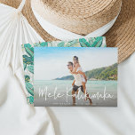 Mele Kalikimaka | Hawaiian Holiday Photo Card<br><div class="desc">Chic full bleed horizontal or landscape-orientated holiday photo card features "Mele Kalikimaka, " the Hawaiian Christmas greeting, in casual white hand lettered script typography as an overlay on your favourite beach or vacation photo. Personalise with your custom holiday message, the year, and your family name beneath. Cards reverse to a...</div>