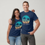Mele Kalikimaka Tropical Sunset Christmas T-Shirt<br><div class="desc">This cute Hawaiian Christmas party t-shirt features a tropical beach sunset on a cool blue background with a drawing of coastal palm trees against a seaside sunset. Mele Kalikimaka written in cursive typography on this pretty holiday tee.</div>