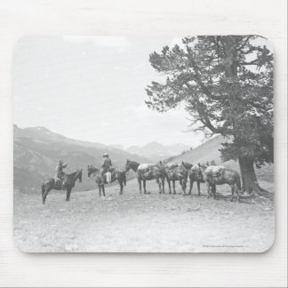 Men with packhorses looking over a hill mouse pad