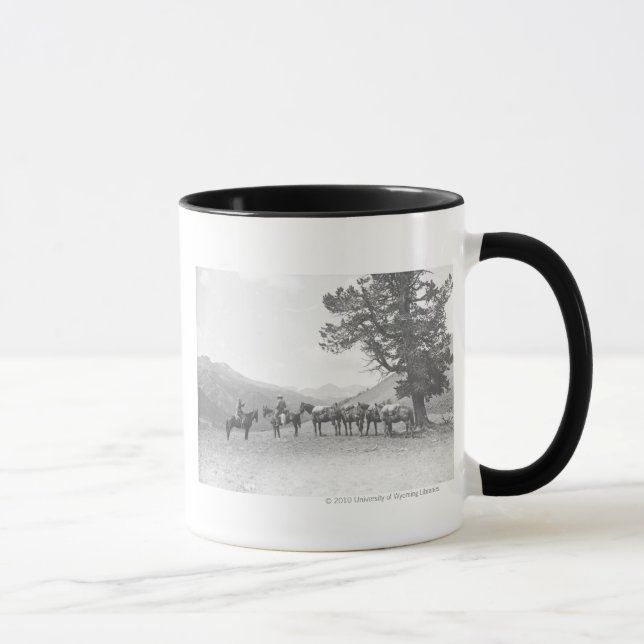 Men with packhorses looking over a hill mug (Right)
