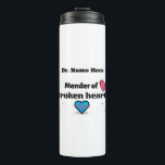 Mender of broken hearts thermal tumbler<br><div class="desc">Customisable thermal tumbler with saying, "Mender of broken hearts." Beautiful design with broken heart, needle and thread. Great gift for the doctor, counsellor, Pastor or therapist in the family, Dad's, Uncles, Sons or, to show appreciation for the nurse, doctor or heart sugeon who cared for you and helped you heal...</div>