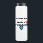 Mender of broken hearts thermal tumbler<br><div class="desc">Customisable thermal tumbler with saying, "Mender of broken hearts." Beautiful design with broken heart, needle and thread. Great gift for the doctor, counsellor, Pastor or therapist in the family, Dad's, Uncles, Sons or, to show appreciation for the nurse, doctor or heart sugeon who cared for you and helped you heal...</div>