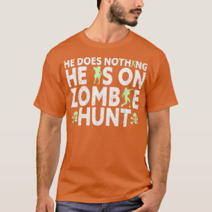 Mens He Is On Zombie Hunt Halloween Apparel Funny T-Shirt