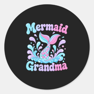 Mens playful mermaid tail with water splashes classic round sticker