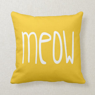 Meow Pillow on yellow and grey background