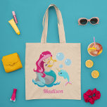 Mermaid Girl Cute Beach Narwhal Monogram Kids Tote Bag<br><div class="desc">Customise this beautiful pink haired mermaid girls tote bag by adding your kid's name. Cute mermaid design with pretty underwater ocean narwhal and under the sea bubbles. Cute gift for a beach or pool outing in the summer.</div>