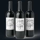 Merry And Bright Christmas Script Calligraphy Wine Label<br><div class="desc">A beautiful modern trendy script typography Christmas holiday wine label gift. Simply personalise with your family name and add this label to your bottle of wine that you are gifting or serving during the holidays. Unique and cheerful style for the holiday season to lift spirits and bring a smile to...</div>