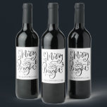 Merry And Bright Christmas Script Calligraphy Wine Label<br><div class="desc">A beautiful modern trendy script typography Christmas holiday wine label gift. Simply personalise with your family name and add this label to your bottle of wine that you are gifting or serving during the holidays. Unique and cheerful style for the holiday season to lift spirits and bring a smile to...</div>