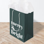 Merry and Bright | Stylish Forest Green Christmas Medium Gift Bag<br><div class="desc">A stylish modern holiday gift bag with a bold retro typography quote "merry & bright" in white on a dark forest green background. The greeting,  message and name can be easily customised to suit your needs. A trendy fun design to stand out this holiday season!</div>