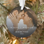 Merry and Married Heart Script Christmas Photo Ornament<br><div class="desc">A modern, minimal, elegant and stylish Christmas ornament for the new Mr and Mrs. Featuring a merry and married heart script calligraphy lettering with a lovely photo of the newly wed couple in faded overlay. You can personalise the photo and text. The placement photo shows a romantic photo of a...</div>