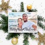 Merry Beachy Christmas fun vacation photo  Holiday Card<br><div class="desc">Share your favourite beach vacation picture with this fun and modern beach Christmas photo card featuring a trendy hand-lettered typography overlay that reads "Merry Beachy Christmas" decorated with waves, sun, and surfboard illustrations. Easily personalizable with one of your favourite holiday pictures and your names. The back of the card features...</div>