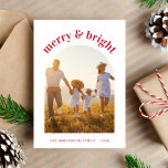 Merry Bright Christmas Family Arch Photo Holiday Card<br><div class="desc">Minimal holiday card featuring your photo in an arched frame. "merry & bright" is written above in trendy modern red typography. Personalise your names and the year in simple red typography. On the reverse,  add two additional photos and a personalised message.</div>