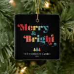Merry & Bright Retro Colourful Christmas Ceramic Ornament<br><div class="desc">This square Christmas tree ornament features the text "Merry & Bright" in a vibrant,  retro style. The text stands out against a black background,  creating a visually striking contrast.  Personalise this retro themed ornament with your name and year. Photography © Storytree Studios,  Stanford,  CA</div>