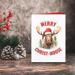 Merry Christ-moose Funny Christmas Moose Holiday Card<br><div class="desc">Embrace the holiday spirit with our charming Christmas card featuring a loveable moose donning a Santa hat on the front, accompanied by the punny greeting “Merry Christ-moose”. Inside, you’ll find a heartwarming verse that captures the essence of the season with a bit of a pun as well. This card is...</div>