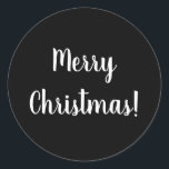 Merry Christmas Black & White Typography Classic Round Sticker<br><div class="desc">Cool and stylish black and white Merry Christmas design. This design has the festive message “Merry Christmas!” In modern white typography text on a black background. Perfect for envelope seals or for the finishing touch to your gifts or favour bags. If you wish to change the message you can do...</div>