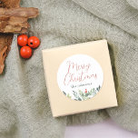 Merry Christmas Calligraphy & Family Name Greenery Classic Round Sticker<br><div class="desc">A chic Christmas sticker, with "Merry Christmas" in elegant red script calligraphy. Underneath, your family name is printed in classic serif typography. At the bottom of the sticker, there is an arrangement of lush winter foliage, bright red berries, holly, and pine. Ideal for sealing envelopes, decorating gift boxes, or embellishing...</div>