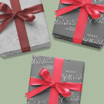 Merry Christmas Calligraphy Silver Snowflakes Wrapping Paper Sheet<br><div class="desc">This design features a merry Christmas calligraphy script wrapping paper merry Christmas calligraphy script, a simple silver snowflakes snow, silver calligraphy stylish trendy font, minimalist pattern winter design, winter silver grey grey white, Christmas holiday wrapping supplies, custom customised personalised gift wrap, simplistic elegant classic classy cute, cute creative typography style...</div>