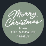 Merry Christmas casual script green holiday gift Classic Round Sticker<br><div class="desc">Add this personalised Merry Christmas sticker to all your Christmas gifts. This sage green Christmas gift sticker features a casual "Merry Christmas" along with custom text. Add a from to your Christmas presents, Christmas party favours and more. Also great as a Christmas cookie sticker or for other food gifts. Find...</div>