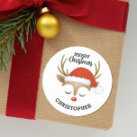 Merry Christmas Cute Kids Reindeer  Classic Round Sticker<br><div class="desc">A cute reindeer face with a santa hat decorates this sticker with the words Merry Christmas. Fun for decorating Christmas gifts and holiday treat bags for neighbours. Personalise it with your name. Designed for you by Blackberry Boulevard.</div>