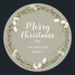 Merry Christmas Family Name Winter Greenery Classic Round Sticker<br><div class="desc">Merry Christmas sticker features your family name in elegant script calligraphy and modern typography and a classic stylish winter greenery wreath with cotton sprigs and white floral on a moss grey background. Simply add your name. Exclusively designed for you by Happy Dolphin Studio. If you need any help or matching...</div>