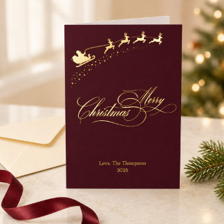 Merry Christmas Gold Foil Burgundy Santa Sleigh Holiday Card