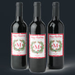 Merry Christmas Greenery Monogram Berry Wreath Wine Label<br><div class="desc">Elegant "Merry Christmas" holiday homemade wine label design features a rustic chic round berry wreath of winter watercolor greenery framing the family's last name monogram initial letter. Personalise the modern red and green wording with a custom greeting, last name, the type of wine, and the year. Clean white background colour...</div>