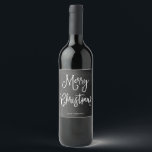 Merry Christmas | Handwritten Script on Chalkboard Wine Label<br><div class="desc">These simple and trendy holiday labels say "Merry Christmas" in rustic,  white handwritten script on a black,  chalkboard look background.</div>